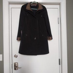 Gallery all weather raincoat with removable hood and lining.